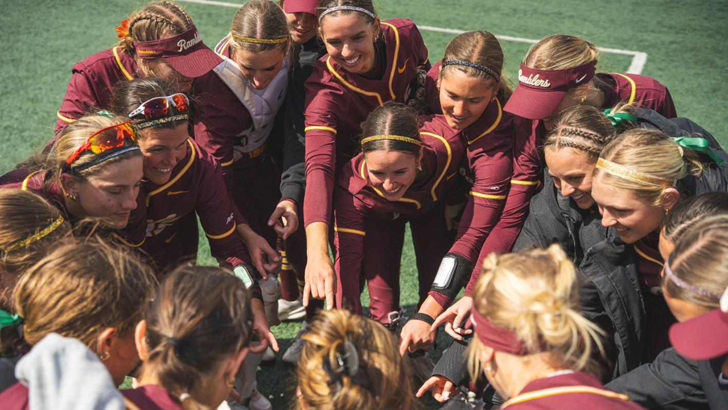 softball students with hands in a circle